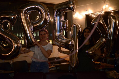 Students holding balloons